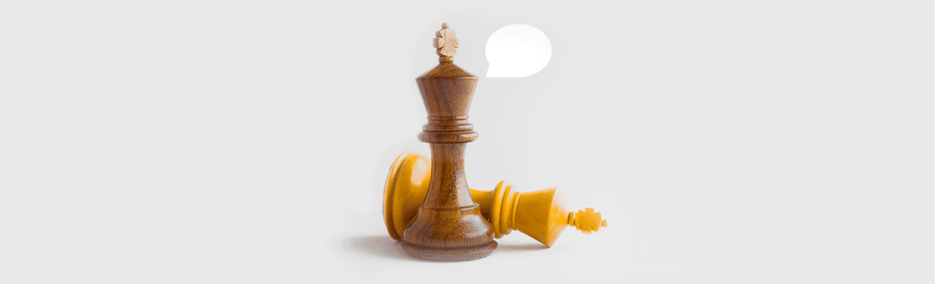 Chess king pieces with a speech bubble